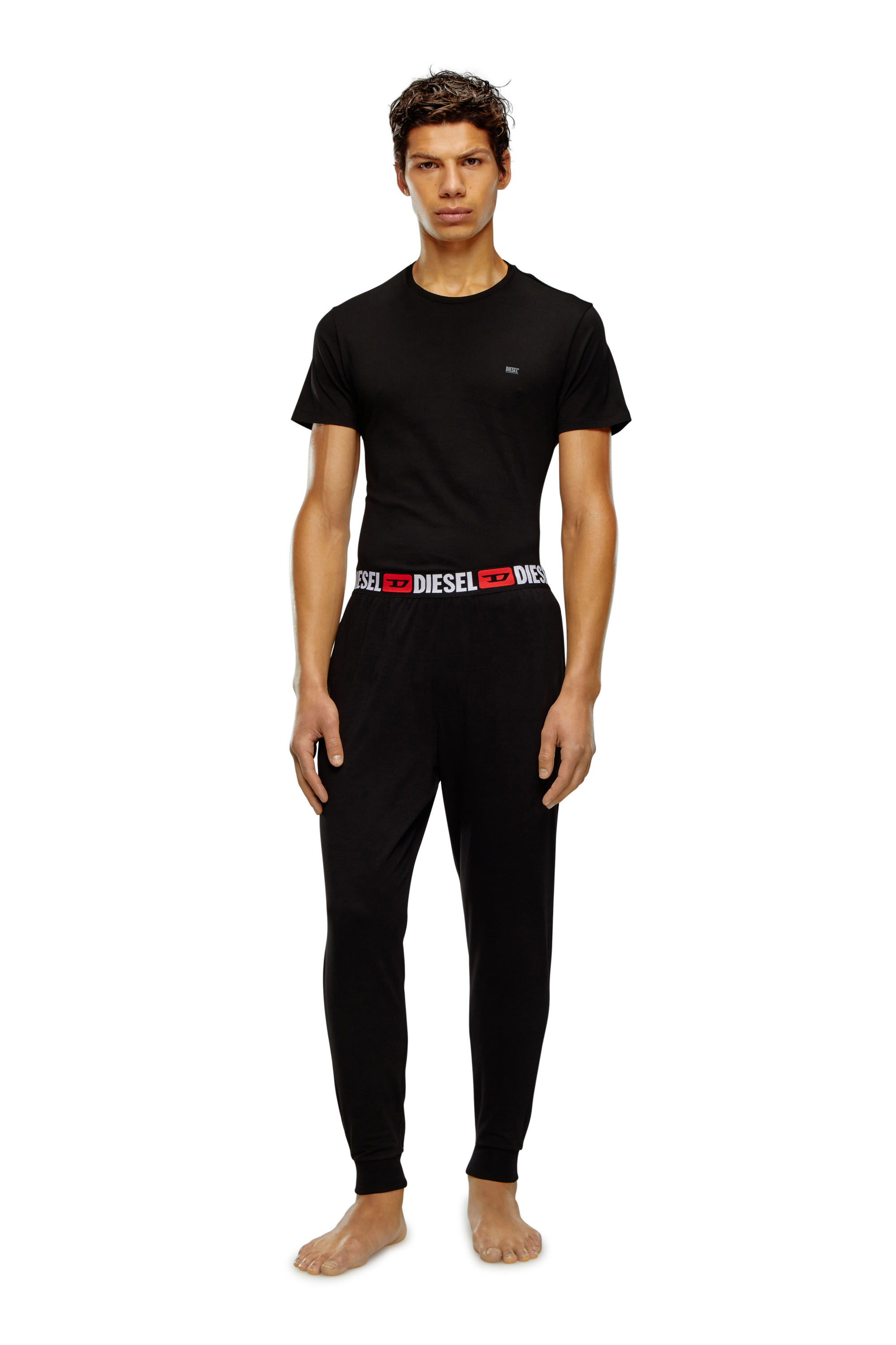 Diesel - UMLB-JULIO, Man Track pants with logo waist in Black - Image 1